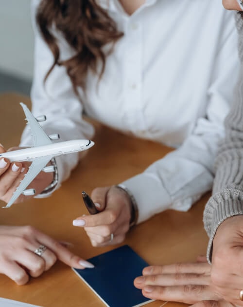 Aircraft management meeting — woman holding miniature airplane model